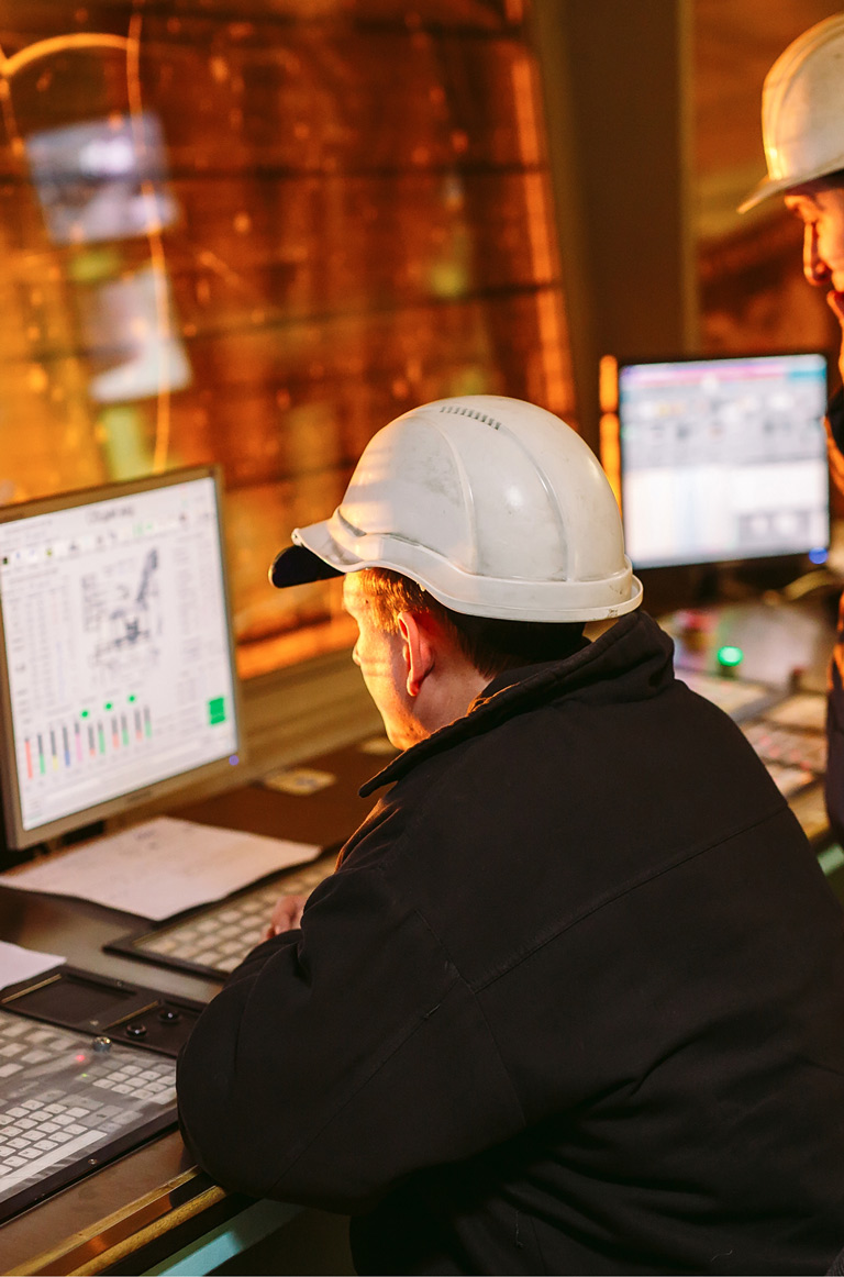 Engineers viewing on screen data in control centre